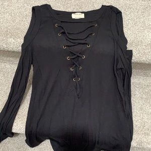 black shirt . Shoulder cutouts